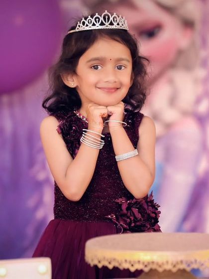 A thrilling 'Spiderman' themed birthday party, with red and blue decor, spiderweb props, and a cityscape backdrop, ready for web-slinging action.