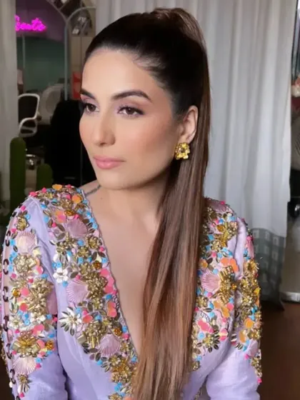 A sleek, high ponytail for designer Shubhika Sharma. This sharp and powerful hairstyle is perfect for a boss lady look, keeping the hair off the face to showcase the intricate details of her outfit.