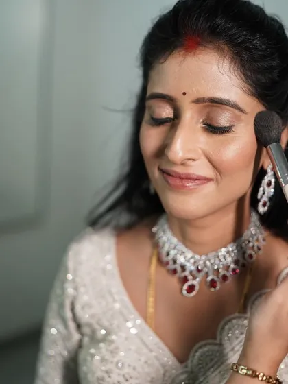 The magic is in the process. Here, I am applying a soft blush to enhance my client's natural glow. My one-on-one workshops are all about hands-on learning, where I guide you through each step on your own face.