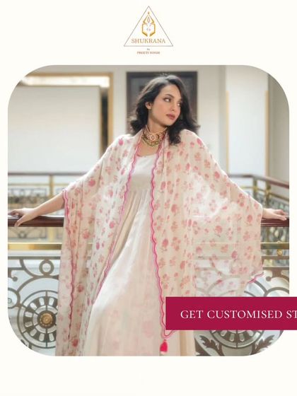 A beautiful floral cape paired with a simple dress. I can help you create customized styles that are both classic and trendy.