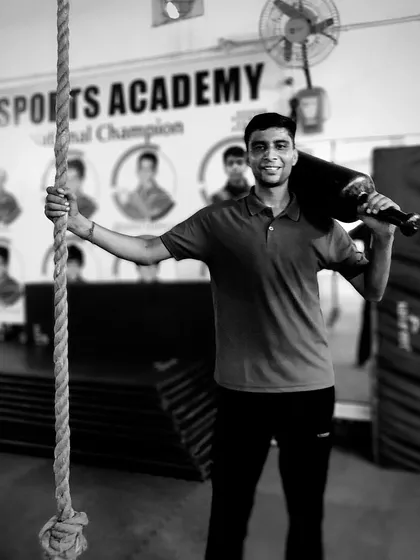 We build strength that matters in a fight. Here I am with a Gada, a traditional tool for developing powerful shoulders and a strong core, essential for Lathi Khel.