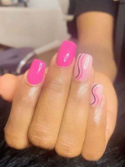 Think pink! A fun manicure with a mix of solid hot pink and abstract swirl art.