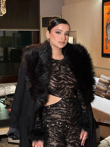 A confident and powerful party look. The sleek hair keeps the focus on the dramatic smokey eyes and the fabulous outfit.