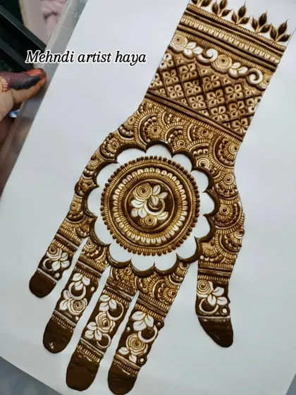 Another view of the mandala practice design, held to show the full composition from wrist to fingertips.