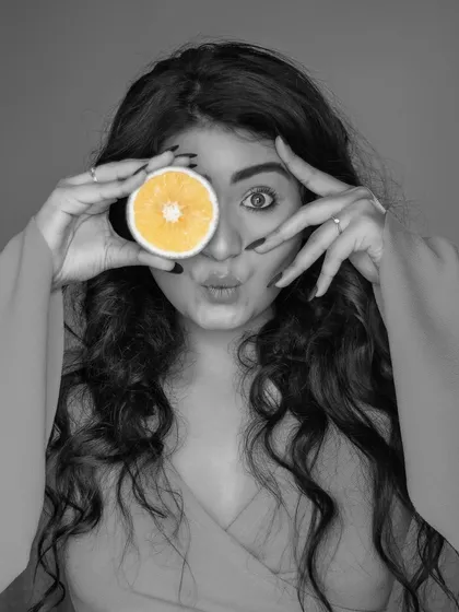 A creative edit from the orange slice series. This black and white image with a pop of yellow on the orange creates a fun, artistic effect that draws the eye.