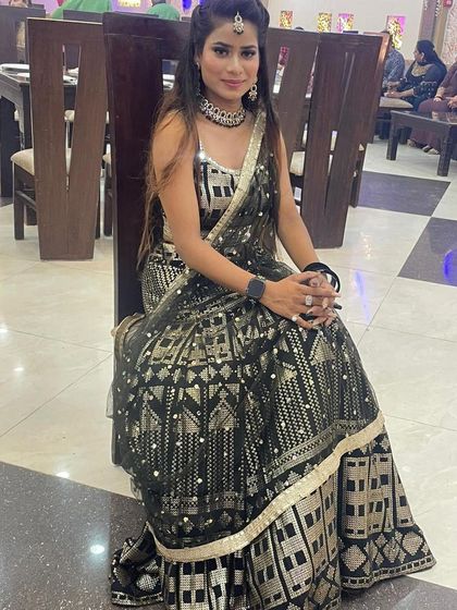This black and gold lehenga with a geometric pattern is a unique rental piece. It’s perfect for a modern, edgy festive look.
