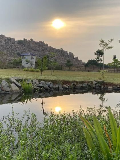 The sun reflects on the water as it sets behind the hills. This is the view that greets you during our ultimate de-stress program, helping you to rebalance, rejuvenate, and revive.