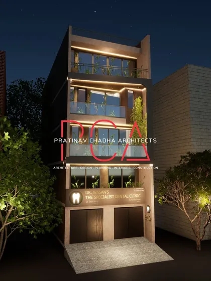 A nighttime render of the Mukherjee Nagar residence, set against a dark sky to emphasize the effect of the architectural lighting.