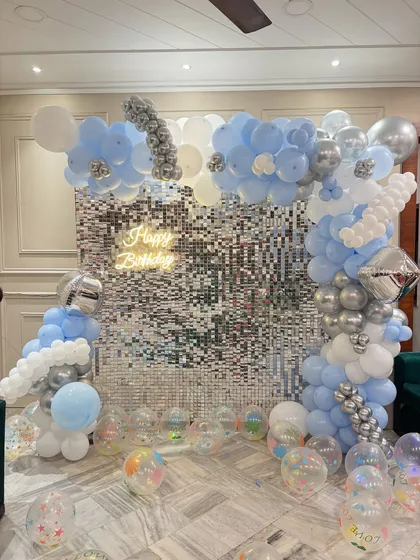 Another perspective of the beautiful blue and silver cloud-themed birthday decor.