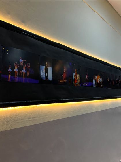 A closer look at the photo gallery wall in our studio. It serves as a constant reminder of the incredible performances and memories we have created together as a dance family.