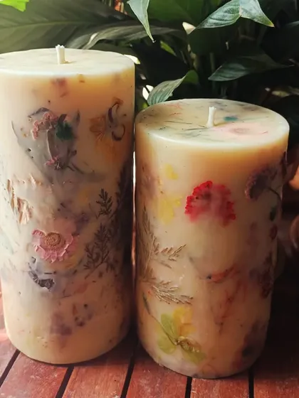 The beauty of handmade. Each of our floral love pillar candles is slightly different, showcasing the natural variation of the real flowers pressed within the wax.