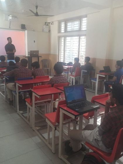 A classroom view of our cybersecurity workshop in progress. Students use laptops to follow along with practical exercises, gaining hands-on experience in digital safety.