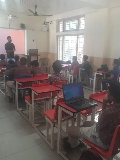 A classroom view of our cybersecurity workshop in progress. Students use laptops to follow along with practical exercises, gaining hands-on experience in digital safety.