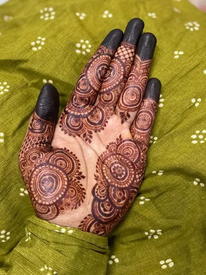 The stain on this circular, repeating pattern came out so rich and dark. This style covers the entire hand in a mesmerizing design that is both bold and intricate.