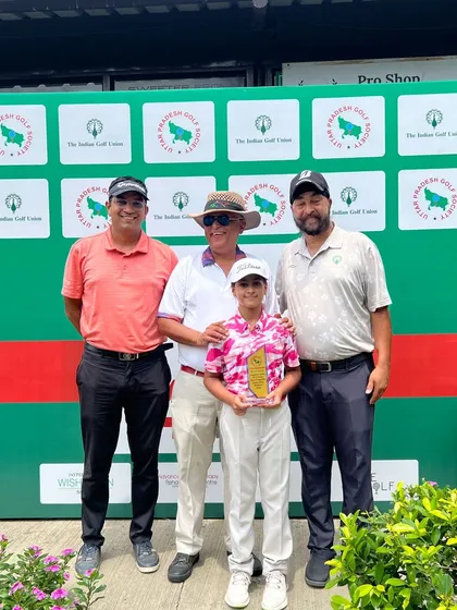 Aaliyah Kalra celebrates her win at the 4th Uttar Pradesh Open with her coaches and mentors.