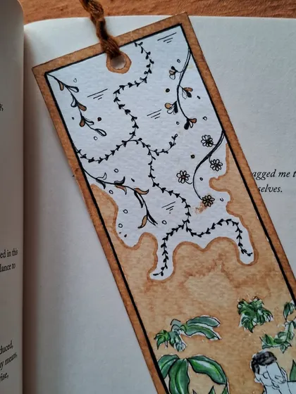 A detailed shot of the floral and abstract patterns on a custom bookmark. I enjoy mixing organic shapes with the unpredictable nature of coffee stains.