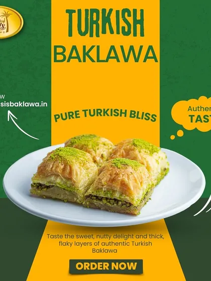Pure Turkish bliss. Four pieces of our classic pistachio baklava served on a plate, showcasing the flaky layers and generous nutty filling.