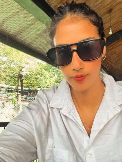 Feeling poised and put-together. My fitness journey is about building the confidence to feel good in any setting, whether I'm in gym clothes or a classic white shirt.