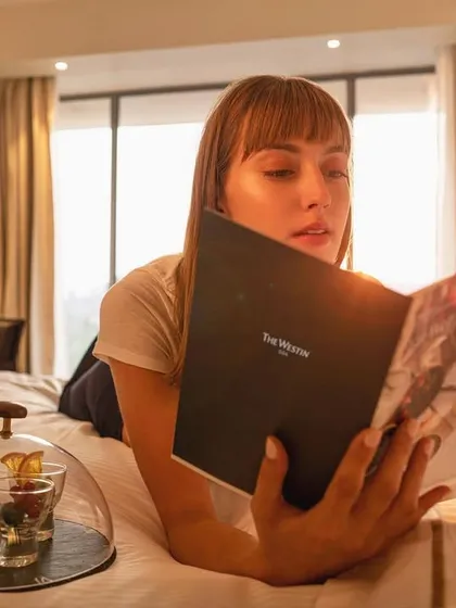 I love checking out the dessert menu right after check-in. This lifestyle shot for The Westin Goa captures a quiet, indulgent moment in the hotel room, making it feel like a true retreat.