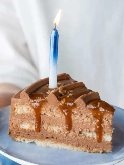 A single slice of our Chocolate Sea Salt Caramel cake, ready for a birthday wish. The combination of sweet caramel and a hint of sea salt is simply irresistible.