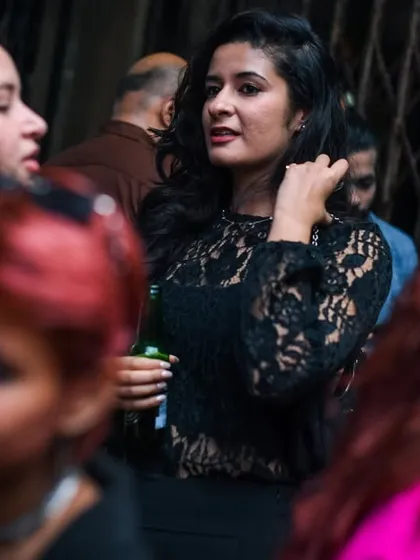 A stylish guest enjoying the night.