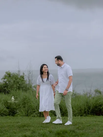 A candid walking shot, capturing a natural moment of conversation and connection between the couple.