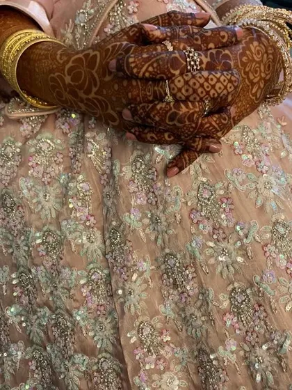 This is the final look of a detailed mehendi design after the stain has fully developed. The color is deep and striking, perfect for an engagement party.