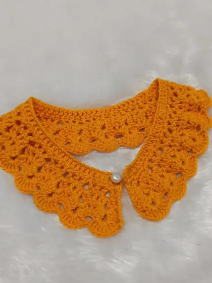 The saffron lacy collar on its own. It’s a versatile piece that can be customized in any color to match your child’s wardrobe.