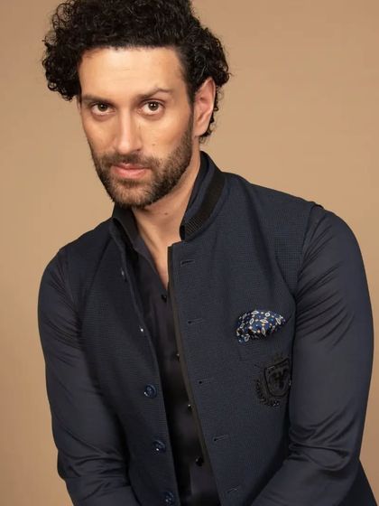 A closer, more personal look at the navy Western Jawahar jacket. It’s a piece that commands attention through its subtle details and impeccable fit.