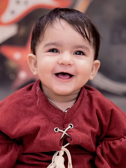 This baby boy may be small, but he has big musical dreams. His happy smile lights up this rock and roll themed first birthday session.