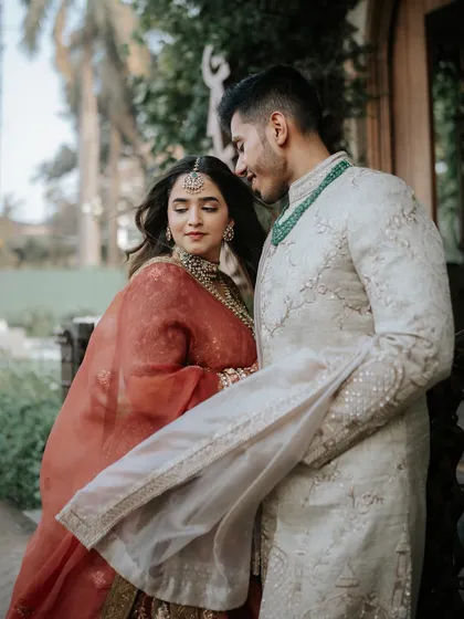A candid moment between the couple, sharing a look of love. This shot captures the natural and easy chemistry between them.