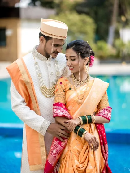 We specialize in capturing the beauty of Maharashtrian weddings. This portrait showcases the couple in traditional attire, highlighting the groom's Pheta and the bride's Nauvari saree and Mundavalya, all captured in soft, natural light.