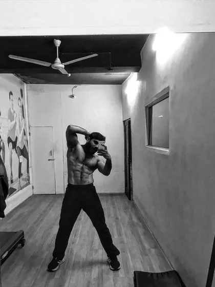 A black and white shot of my physique, highlighting the hard work.