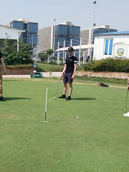 Participants in our beginner's workshop practice their putting technique. We provide all equipment, so you can try the sport without any initial investment.