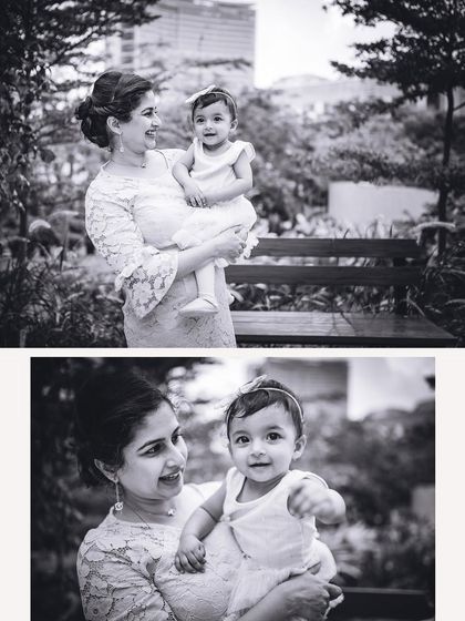 A classic black and white portrait of a mother and her baby girl. The monochrome edit emphasizes their expressions and the loving connection between them.