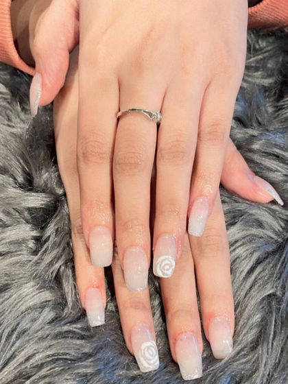 A more subtle version of the rose design, with delicate white roses on a shimmery, translucent white base.