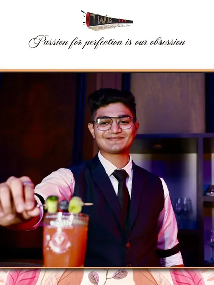 A refreshing cocktail garnished with cucumber, perfect for a sundowner or daytime event.