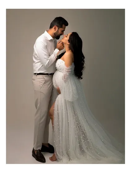 The quiet moments between two people before they become three are so precious. This elegant couple's portrait captures the love and anticipation that fills the air during a maternity session.