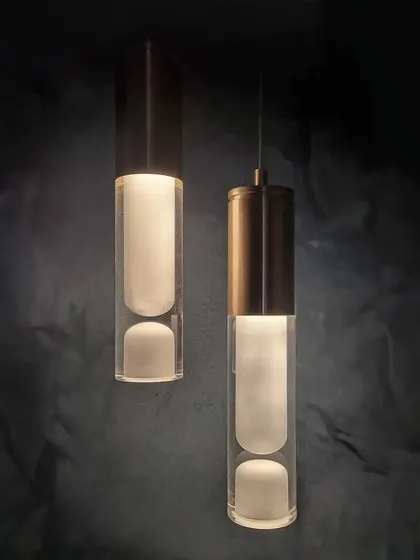 A look at our 'ALMOST' pendant lights, an experimental piece born from our object explorations. Each light is crafted from CNC milled acrylic and brass, capturing a soft glow within a solid, modern form.