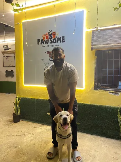 Ditto's reunion with his paw-rent after a long stay. That happy Labrador smile says it all.