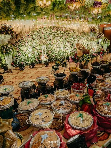 An angled view showing the immense detail and texture of a massive floral installation for a wedding.