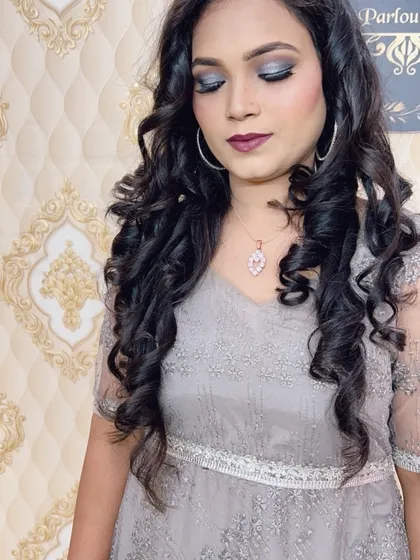 Another shot of the same party look, with eyes closed to show the full effect of the silver and grey smokey eyeshadow.