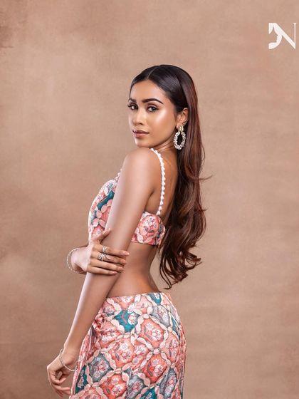 The straight, sleek hair and minimal makeup create a very chic and modern aesthetic.