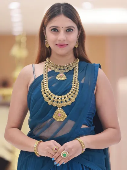 A classic half-body portrait, ideal for showcasing a full set of necklace, earrings, and bangles.