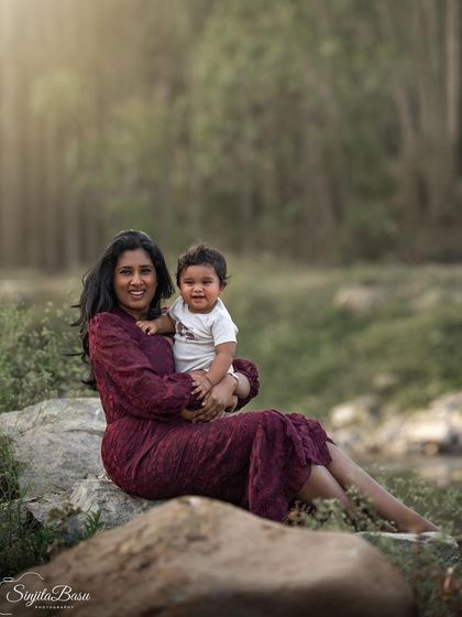 A mother's joy begins with that first tiny heartbeat. Here, Keertana and her baby share a moment of pure happiness by the water, a perfect example of the beautiful new life that motherhood brings.
