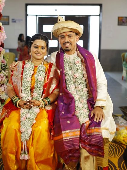 A portrait of the happy couple after the wedding rituals. Both bride and groom look fresh and happy.