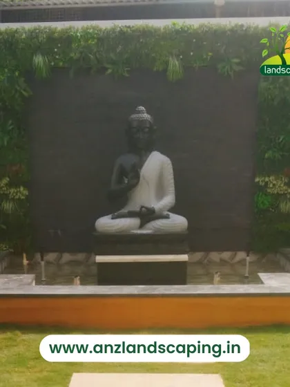 We design gardens that reflect peace and personality. Here, a vertical garden serves as a living frame for a tranquil Buddha statue and water feature, creating a dedicated space for meditation and relaxation in a residential backyard.