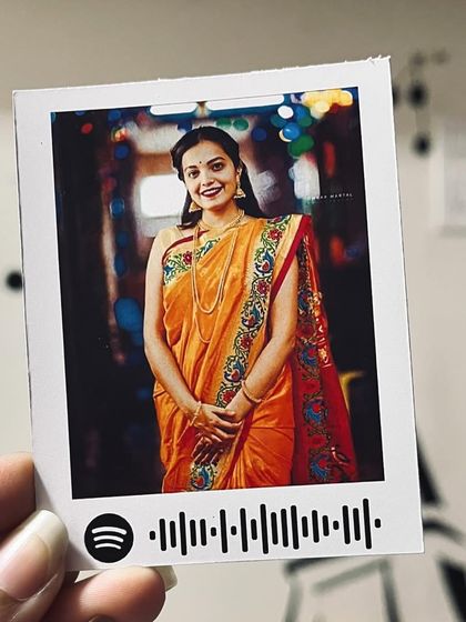 A beautiful portrait in a saree turned into a Spotify polaroid print.
