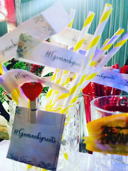 A collection of custom-tagged straws with the '#Gauravbipreeti' hashtag, ready for guests to enjoy.