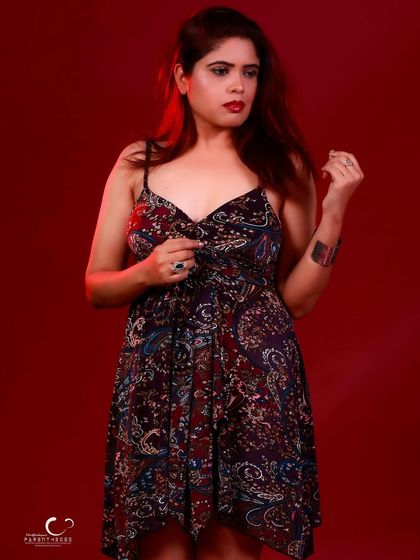 A pensive and thoughtful pose. The composition is simple, allowing her expression to be the focal point.